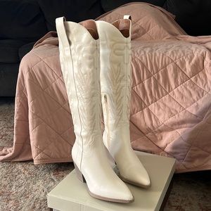 White knee high cowboy boots. Never been worn!